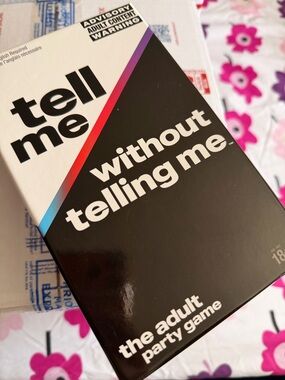 Tell Me Without Telling Me — The Adult Party Game (Black with Rainbow Accent)
